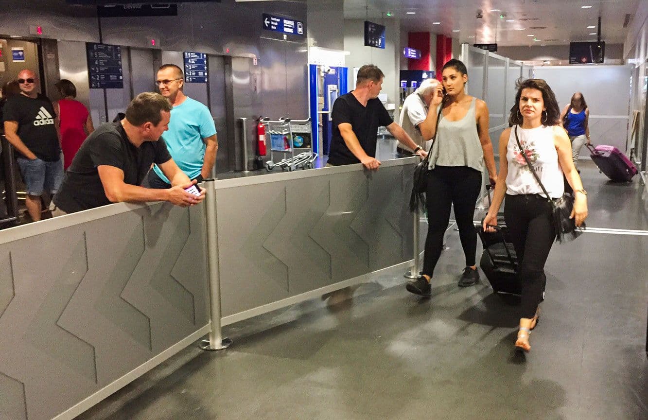 Post and Panel barriers guide arriving passengers through the customs exit area of an airport.