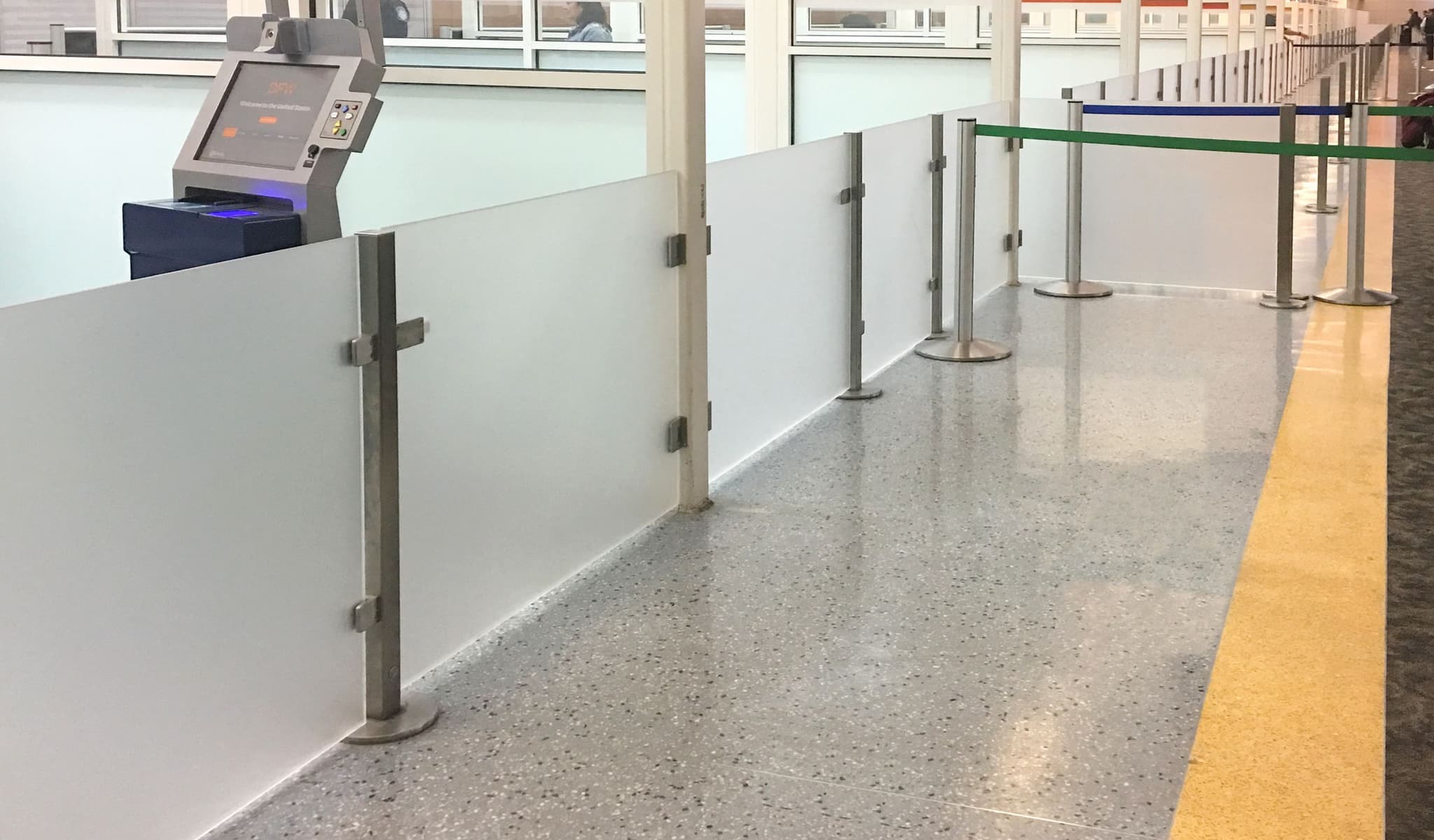 Architectural Partition Walls on magnetic bases divide passenger areas at Dallas Fort Worth International Airport.
