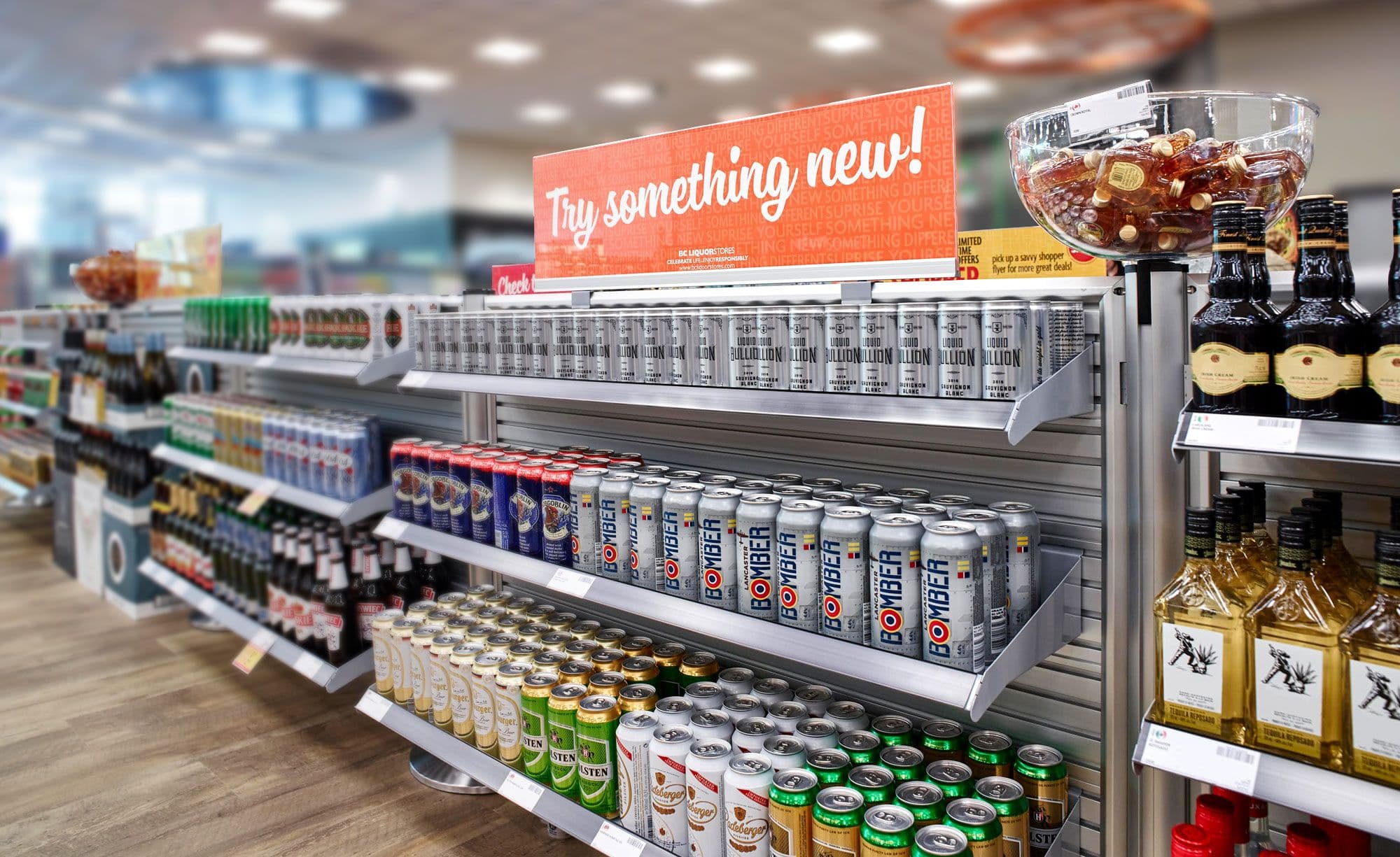NeXtrac slatwall shelving and signage merchandise the checkout queue at a BC Liquor store.