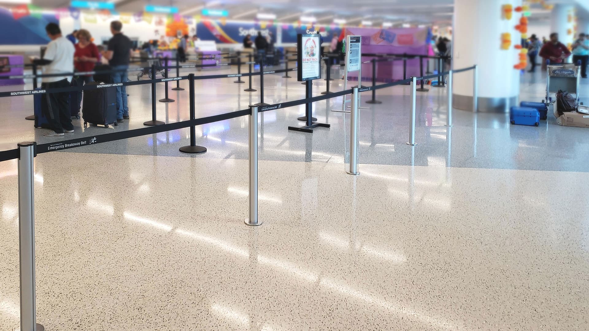 Beltrac retractable belt stanchions form the check-in queue at the Southwest Airlines terminal at Los Angeles International Airport.