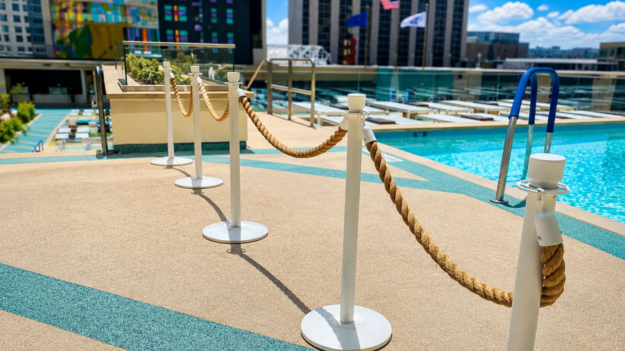 Traditional post and rope stanchions guide guests along the pool deck at Circa Resort and Casino in Las Vegas.