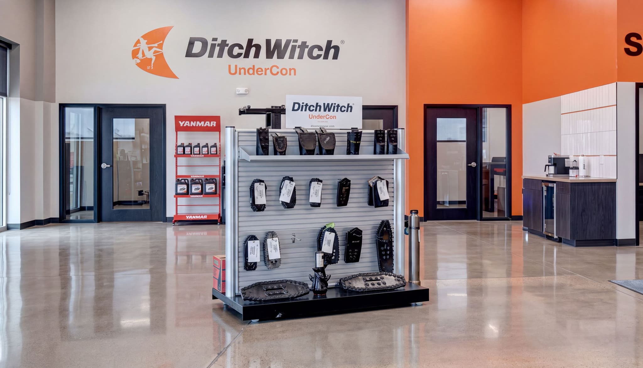 A double-sided NeXtrac gondola displays merchandise in the Ditch Witch showroom.