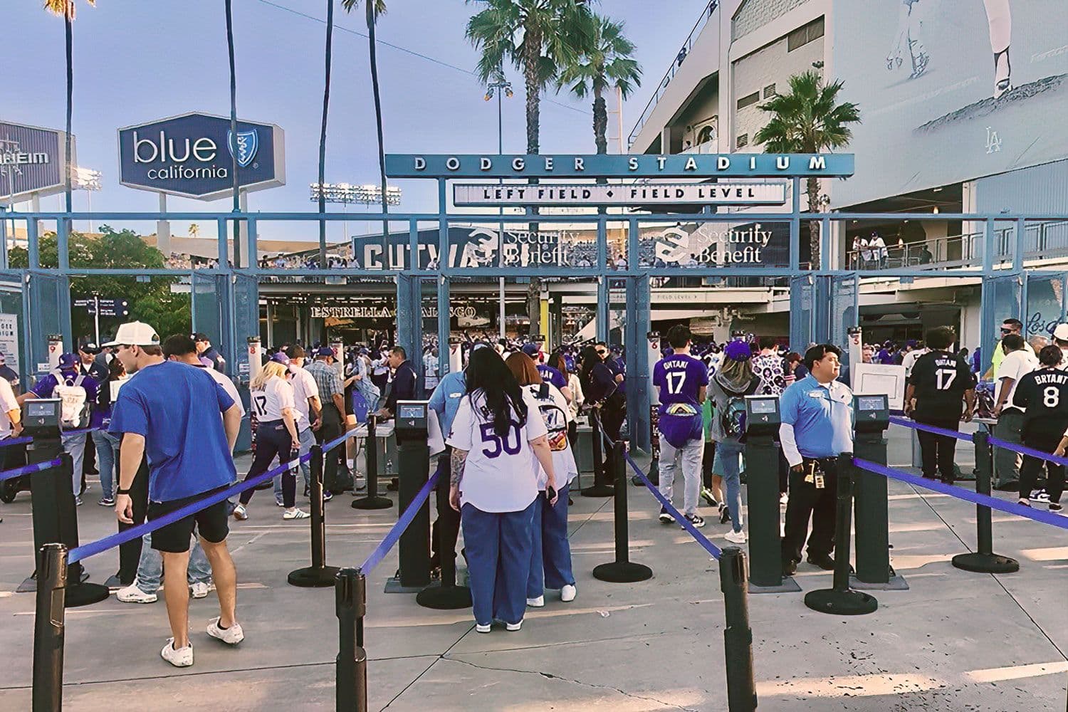 Tempest outdoor stanchions in Dodger blue guide fans through the entry lines at Dodger Stadium during the World Series.