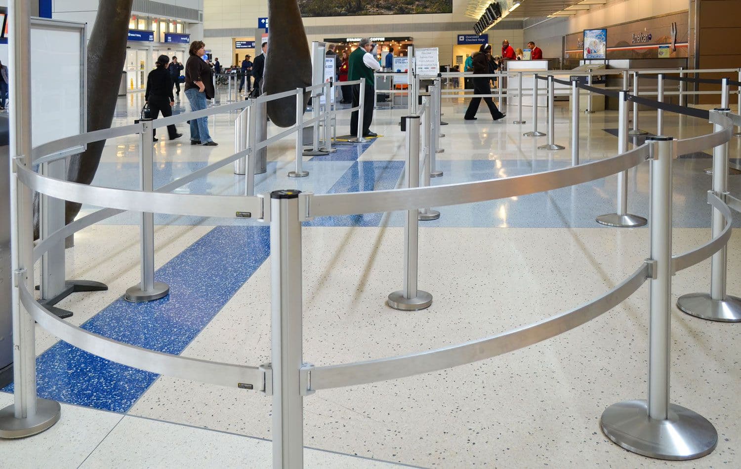 Rigid rails form a security queue at DFW Airport