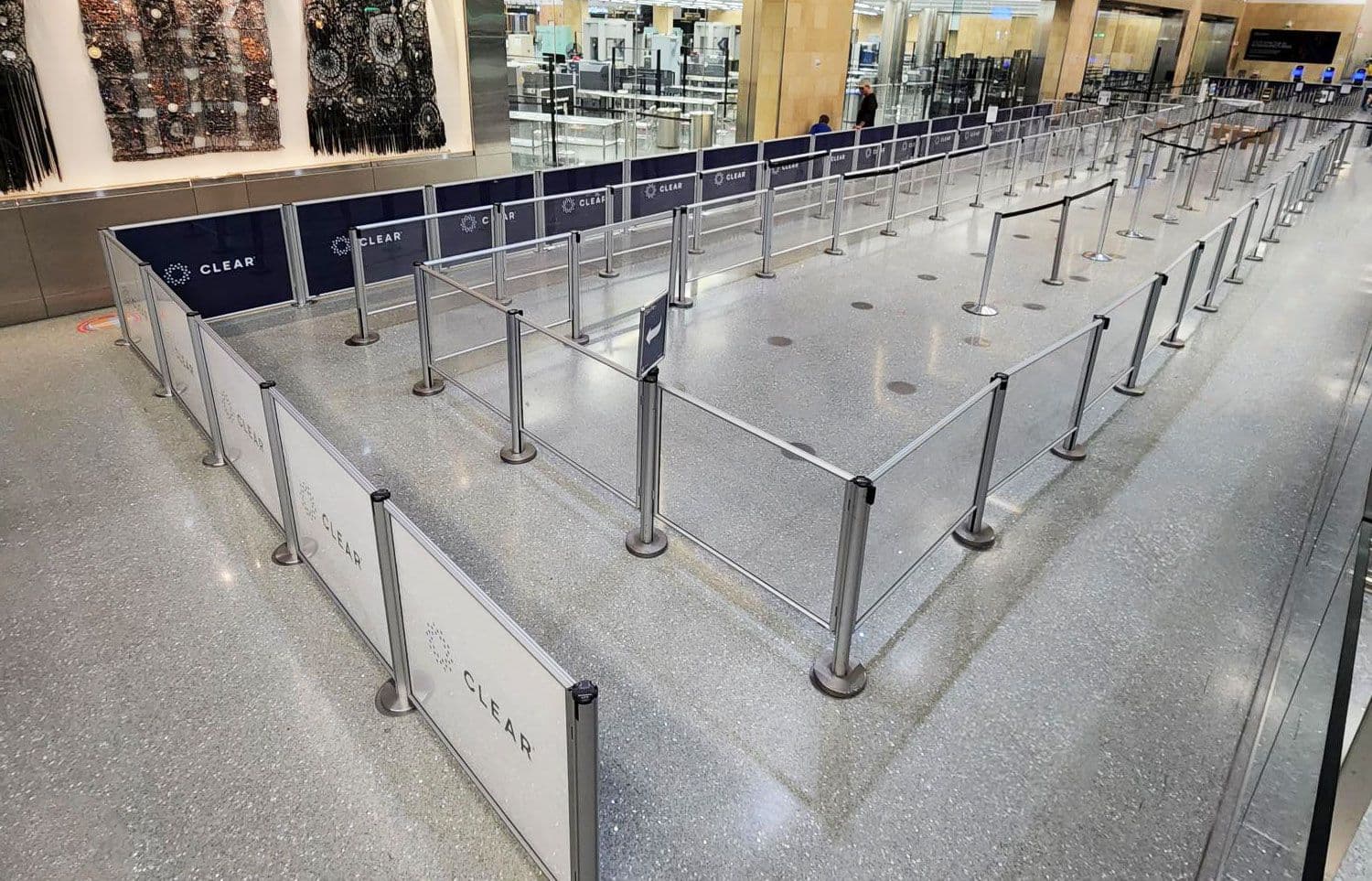 Post and Panel barriers with printed graphics form the CLEAR screening queue at San Diego International Airport.