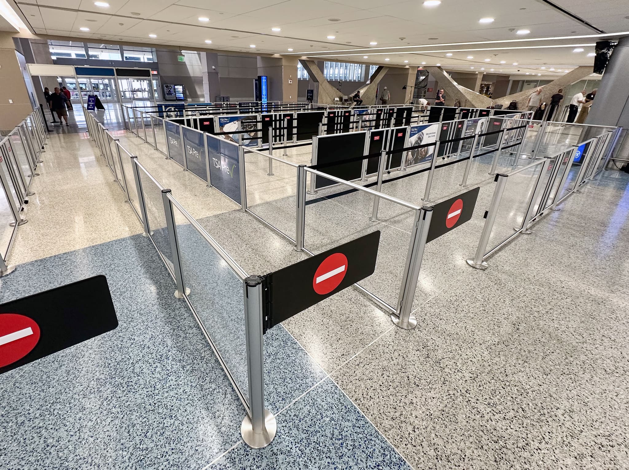 Beltrac stanchion swing gates mark the exit lanes at the TSA Innovation Checkpoint at Harry Reid International Airport.