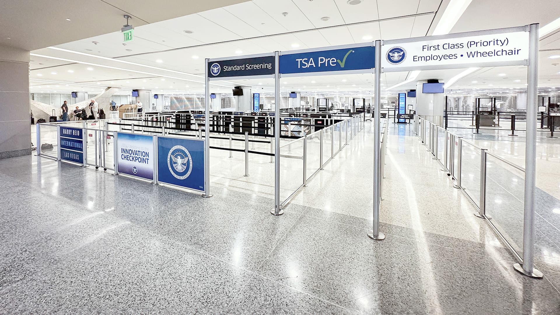Beltrac stanchions with Rigid Rail panels and overhead signs form the TSA Innovation Checkpoint at Harry Reid International Airport.