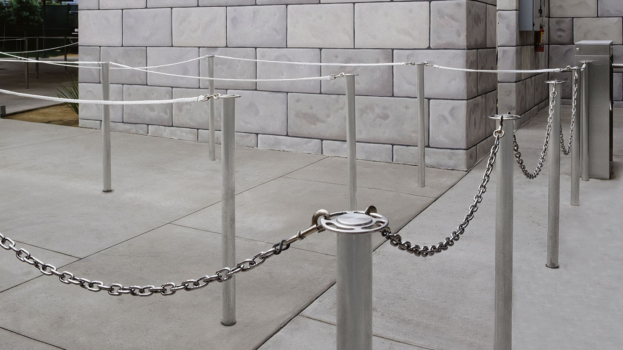 Removable traditional posts with chain guide guests through a ride queue at Universal Studios.