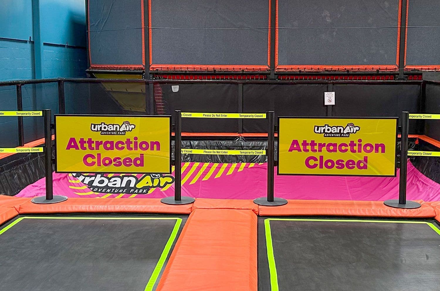 Post and Panel barriers with printed Attraction Closed panels block an attraction at an Urban Air adventure park.