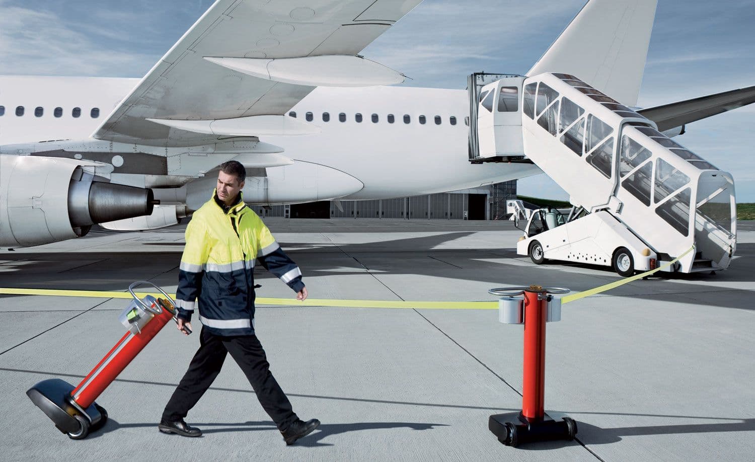 JetTrac mobile retractable belt barrier being deployed on an airport apron