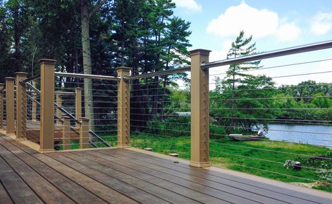 Cable railing creates a guardrail on an outside deck with unobstructed views