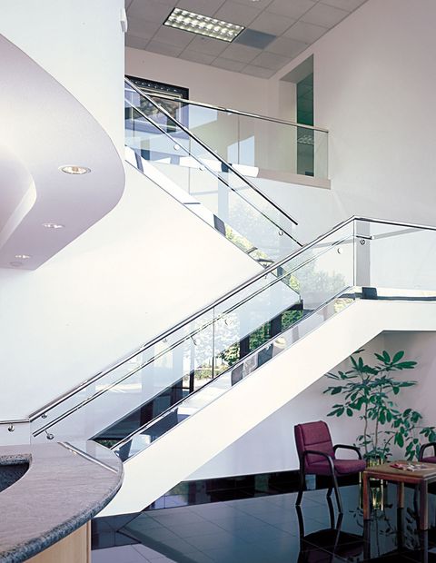 Commercial railing system for stairs using glass railing posts and channel tubing